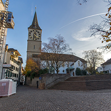 ZURICH, SWITZERLAND - 28 OCTOBER 2015 : St. Peter Church and autumn trees, City of Zurich, Switzerland