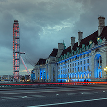 LONDON, ENGLAND - JUNE 16 2016: Night photo of The London Eye and County Hall from Westminster bridge, London, England, Great Britain