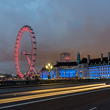 LONDON, ENGLAND - JUNE 16 2016: Night photo of The London Eye and County Hall from Westminster bridge, London, England, Great Britain