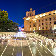 SOFIA, BULGARIA - JULY 21, 2017: Night photo of Fountain in front of The Building of the Presidency and Former Communist Party House in Sofia, Bulgaria