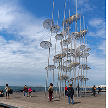 THESSALONIKI, GREECE - SEPTEMBER 30, 2017: People under Umbrellas sculpture in of of city of Thessaloniki, Central Macedonia, Greece