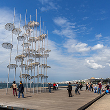 THESSALONIKI, GREECE - SEPTEMBER 30, 2017: People under Umbrellas sculpture in of of city of Thessaloniki, Central Macedonia, Greece