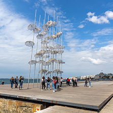 THESSALONIKI, GREECE - SEPTEMBER 30, 2017: People under Umbrellas sculpture in of of city of Thessaloniki, Central Macedonia, Greece