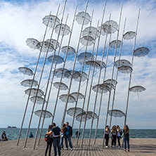 THESSALONIKI, GREECE - SEPTEMBER 30, 2017: People under Umbrellas sculpture in of of city of Thessaloniki, Central Macedonia, Greece