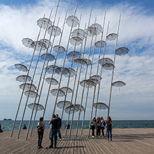 THESSALONIKI, GREECE - SEPTEMBER 30, 2017: People under Umbrellas sculpture in of of city of Thessaloniki, Central Macedonia, Greece