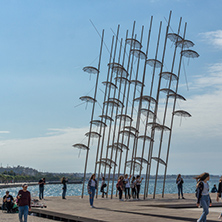 THESSALONIKI, GREECE - SEPTEMBER 30, 2017: People under Umbrellas sculpture in of of city of Thessaloniki, Central Macedonia, Greece