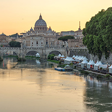 ROME, ITALY - JUNE 22, 2017: Amazing Sunset view of Tiber River, St. Angelo Bridge and St. Peter"s Basilica in Rome, Italy