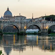 ROME, ITALY - JUNE 22, 2017: Amazing Sunset view of Tiber River, St. Angelo Bridge and St. Peter"s Basilica in Rome, Italy