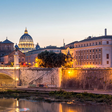 ROME, ITALY - JUNE 22, 2017: Amazing Sunset view of Tiber River and St. Peter"s Basilica from St. Angelo Bridge in Rome, Italy