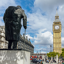 LONDON, ENGLAND - JUNE 16 2016: Monument of Winston Churchill and Big Ben, London, England, United Kingdom