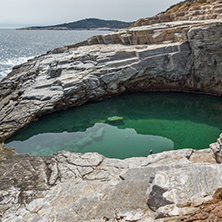 Green waters of Giola Natural Pool in Thassos island, East Macedonia and Thrace, Greece