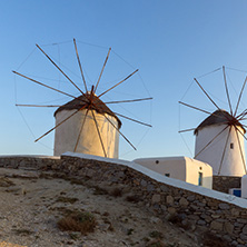 MYKONOS, GREECE - MAY 1, 2013: Amazing sunset and white windmills in Mykonos, Cyclades Islands, Greece