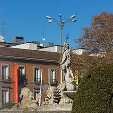 MADRID, SPAIN - JANUARY 22, 2018: Neptuno Fountain and Thyssen Bornemisza Museum in City of Madrid, Spain