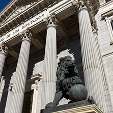 MADRID, SPAIN - JANUARY 22, 2018: Lion sculpture in front of Building of Congress of Deputies (Congreso de los Diputados) in City of Madrid, Spain