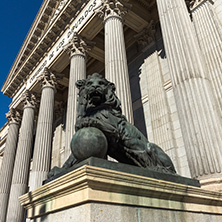 MADRID, SPAIN - JANUARY 22, 2018: Lion sculpture in front of Building of Congress of Deputies (Congreso de los Diputados) in City of Madrid, Spain