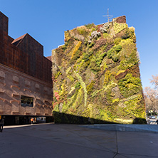 MADRID, SPAIN - JANUARY 22, 2018: Vertical garden wall and CaixaForum Museum in City of Madrid, Spain