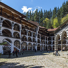 RILA MONASTERY, BULGARIA - APRIL 21, 2018: Tourist visiting Monastery of Saint Ivan (John) of Rila (Rila Monastery), Kyustendil Region, Bulgaria