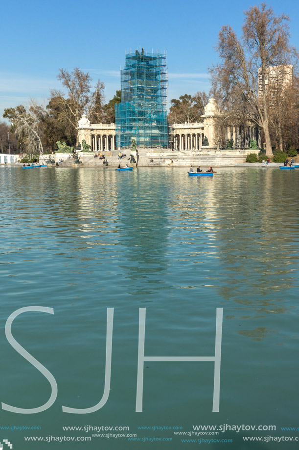 MADRID, SPAIN - JANUARY 22, 2018: Large pond of the Retiro and Monument to Alfonso XII in The Retiro Park in City of Madrid, Spain