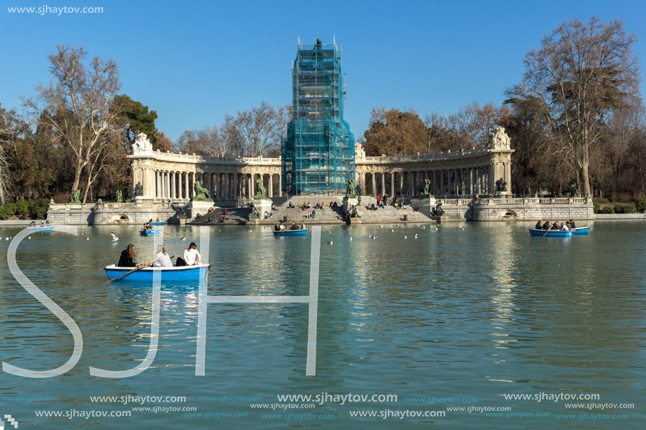 MADRID, SPAIN - JANUARY 22, 2018: Large pond of the Retiro and Monument to Alfonso XII in The Retiro Park in City of Madrid, Spain