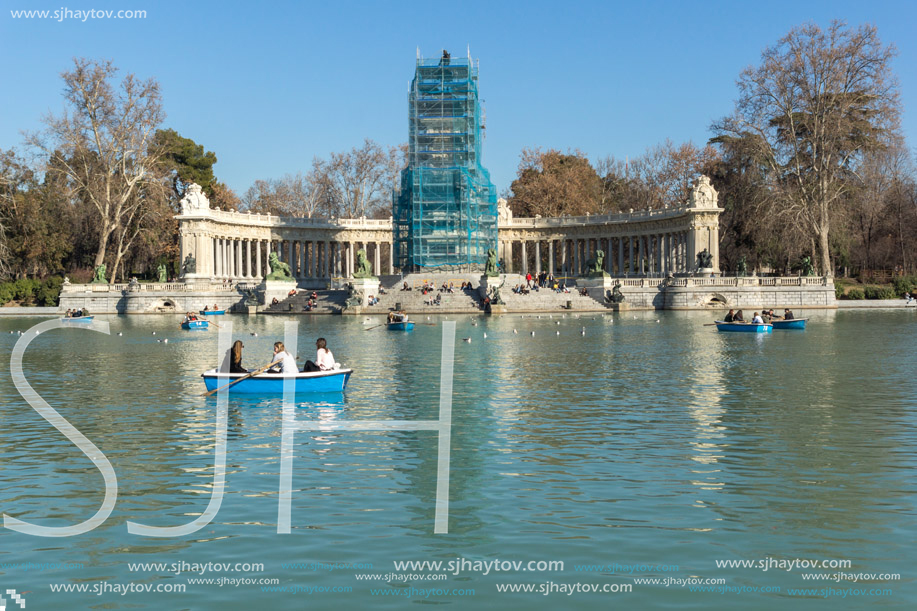 MADRID, SPAIN - JANUARY 22, 2018: Large pond of the Retiro and Monument to Alfonso XII in The Retiro Park in City of Madrid, Spain