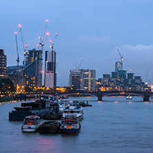 LONDON, ENGLAND - JUNE 16 2016: Night photo of The London Eye and County Hall from Westminster bridge, London, England, Great Britain