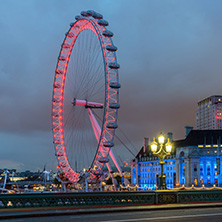 LONDON, ENGLAND - JUNE 16 2016: Night photo of The London Eye and County Hall from Westminster bridge, London, England, Great Britain