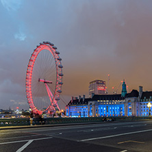 LONDON, ENGLAND - JUNE 16 2016: Night photo of The London Eye and County Hall from Westminster bridge, London, England, Great Britain