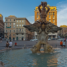 ROME, ITALY - JUNE 24, 2017: Yellow Sunset at Triton Fountain at Piazza Barberini in Rome, Italy