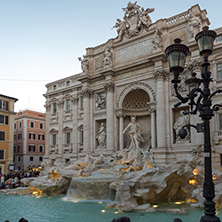 ROME, ITALY - JUNE 24, 2017: Sunset view of Tourist visiting Trevi Fountain (Fontana di Trevi) in city of Rome, Italy