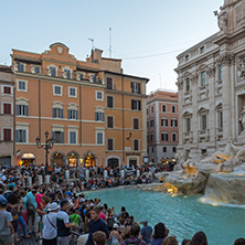 ROME, ITALY - JUNE 24, 2017: Sunset view of Tourist visiting Trevi Fountain (Fontana di Trevi) in city of Rome, Italy