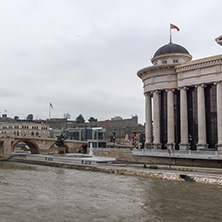 SKOPJE, REPUBLIC OF MACEDONIA - FEBRUARY 24, 2018: Skopje City Center - Archaeological Museum, Old Stone bridge and Vardar River, Republic of Macedonia