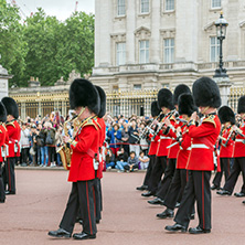 LONDON, ENGLAND - JUNE 17, 2016: British Royal guards perform the Changing of the Guard in Buckingham Palace, London, England, Great Britain