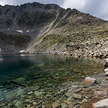 Amazing panoramic view of Ledenoto (Ice) Lake and clouds over Musala Peak, Rila mountain, Bulgaria