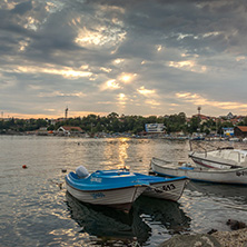 TSAREVO, BULGARIA - JUNE 28, 2013: Sunset at Old boat at the port town of Tsarevo, Burgas Region, Bulgaria