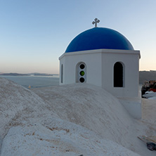 White Orthodox church in town of Oia, Santorini island, Thira, Cyclades, Greece