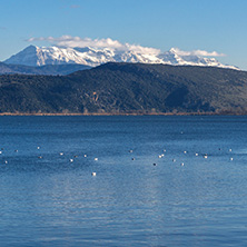 Amazing winter Landscape of Lake Pamvotida and Pindus mountain from city of Ioannina, Epirus, Greece