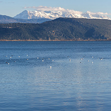 Amazing winter Landscape of Lake Pamvotida and Pindus mountain from city of Ioannina, Epirus, Greece