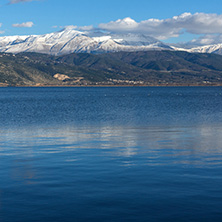 Amazing winter Landscape of Lake Pamvotida and Pindus mountain from city of Ioannina, Epirus, Greece