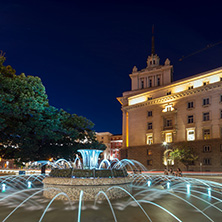 SOFIA, BULGARIA - JULY 21, 2017: Night photo of Fountain in front of The Building of the Presidency and Former Communist Party House in Sofia, Bulgaria