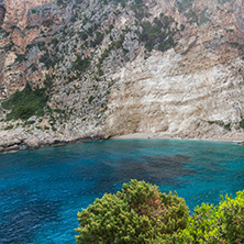 Blue water and rocks of beach at Zakynthos island, Greece