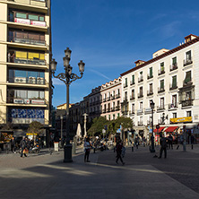 MADRID, SPAIN - JANUARY 23, 2018: Tourist visiting  Plaza de Jacinto Benavente in City of Madrid, Spain