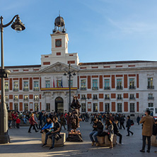 MADRID, SPAIN - JANUARY 23, 2018:  Sunset view of walking people at Puerta del Sol in Madrid, Spain