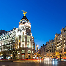 MADRID, SPAIN - JANUARY 23, 2018:  Sunset view of Gran Via and Metropolis Building (Edificio Metropolis) in City of Madrid, Spain