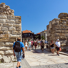 NESSEBAR, BULGARIA - AUGUST 12, 2018: Tourist visiting ruins of Ancient Fortifications at the entrance of old town of Nessebar, Burgas Region, Bulgaria